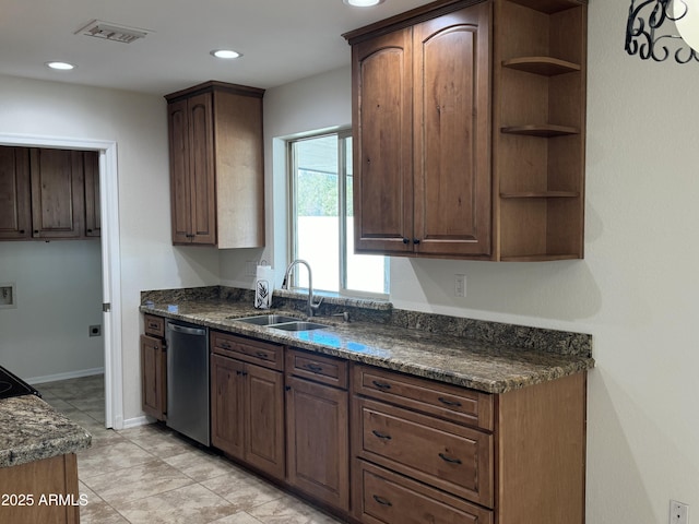 kitchen with stainless steel dishwasher, dark brown cabinetry, sink, and dark stone counters