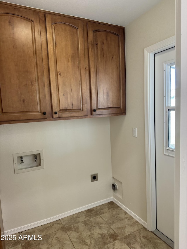 clothes washing area with cabinets, hookup for a washing machine, and electric dryer hookup