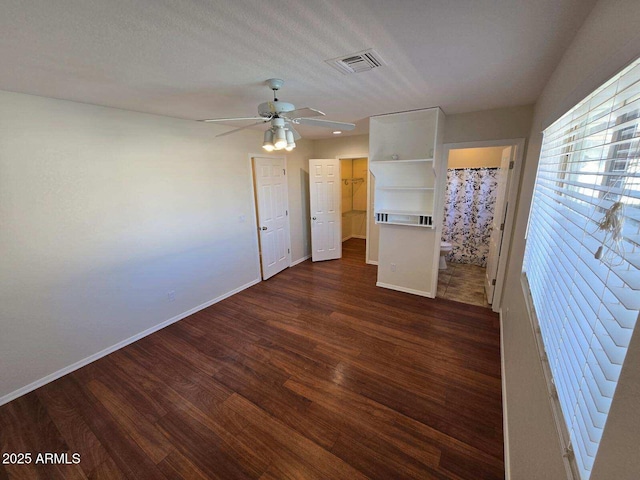 unfurnished room featuring dark hardwood / wood-style floors and ceiling fan