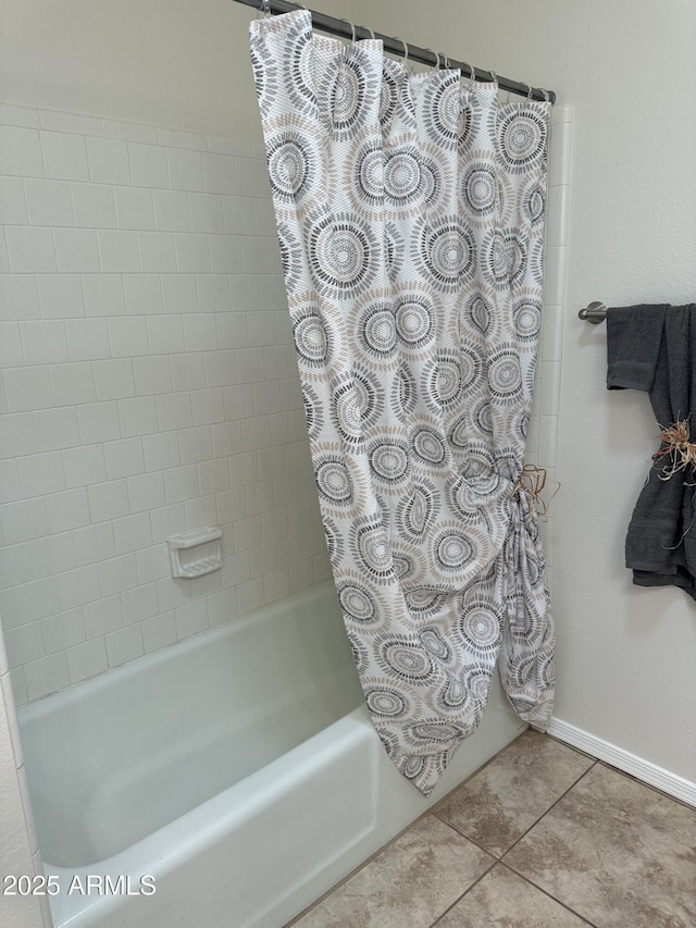 bathroom featuring tile patterned flooring and shower / bath combo with shower curtain