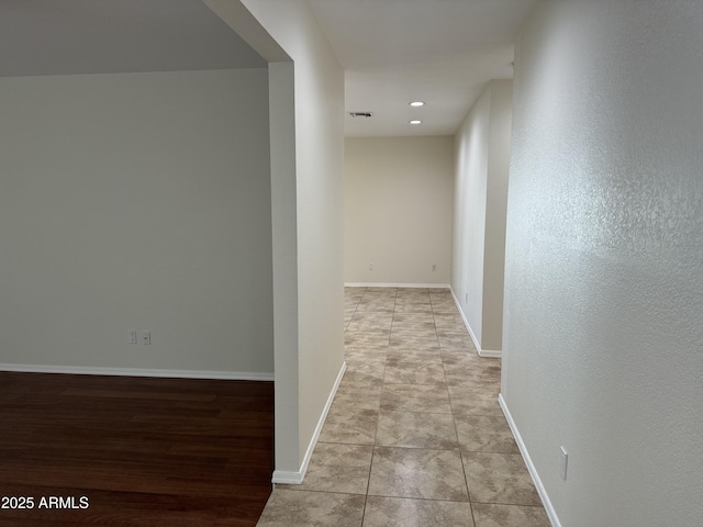 hallway featuring light tile patterned floors