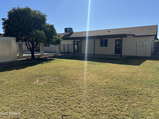 view of yard with cooling unit and a patio area