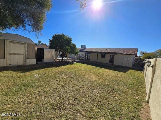 view of yard with a storage shed