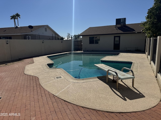 view of pool featuring central AC and a patio