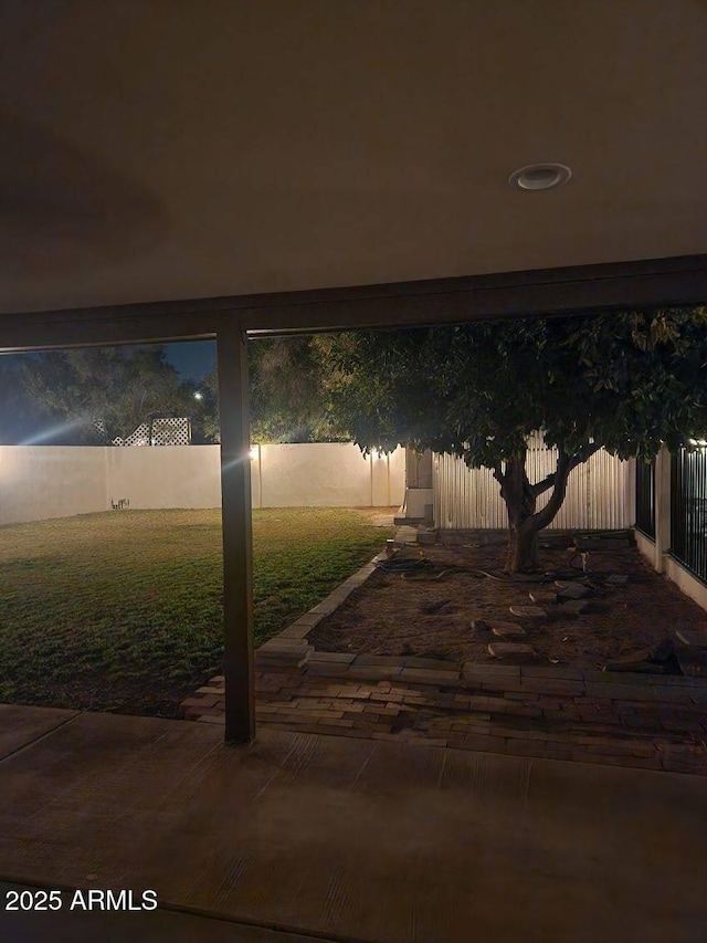 patio at night with a lawn