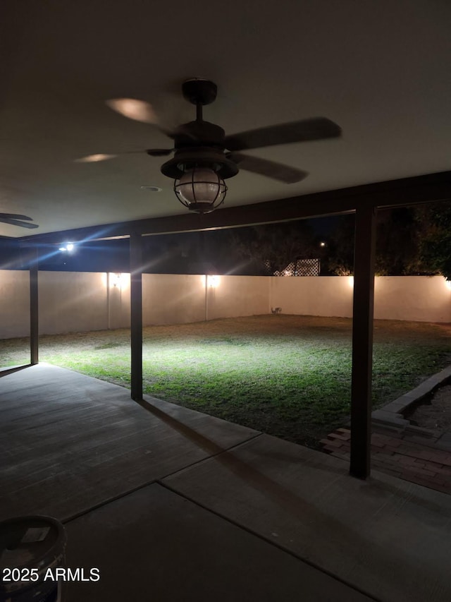 interior space with ceiling fan