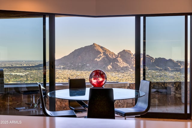 dining room featuring a mountain view