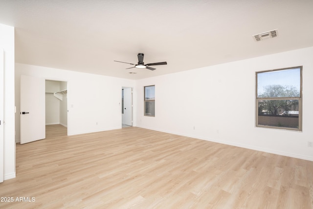 12424 N B St, El Mirage, AZ 85335 - empty room with light wood-style floors, a ceiling fan, and baseboards