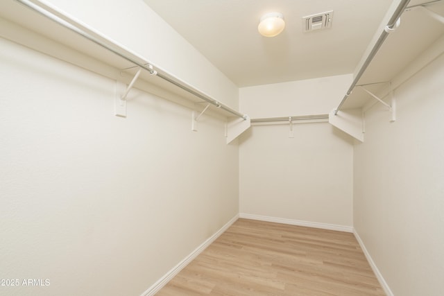 12424 N B St, El Mirage, AZ 85335 - spacious closet with light wood finished floors