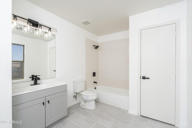 12424 N B St, El Mirage, AZ 85335 - full bathroom with toilet, tile patterned flooring, vanity, baseboards, and shower / tub combination