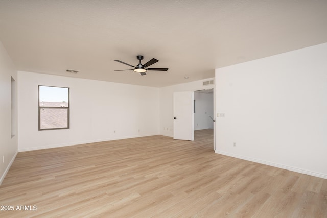 12424 N B St, El Mirage, AZ 85335 - empty room with light wood-style floors, ceiling fan, and baseboards