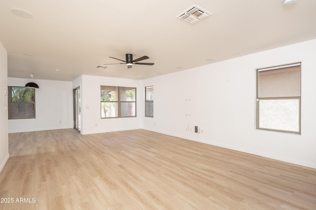 12424 N B St, El Mirage, AZ 85335 - unfurnished room with a ceiling fan, light wood-style floors, and baseboards