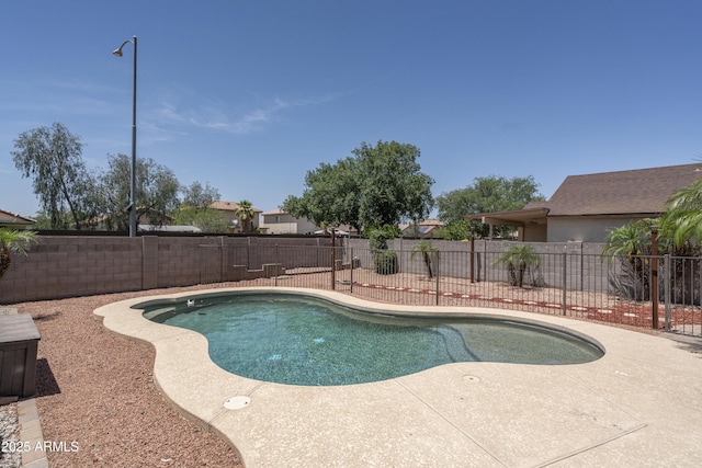 12424 N B St, El Mirage, AZ 85335 - view of swimming pool with a fenced backyard and a patio