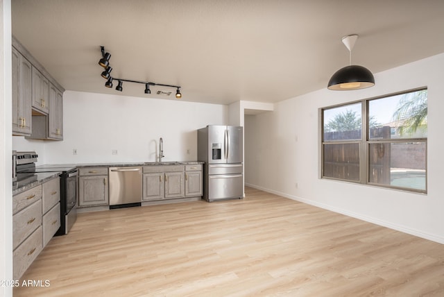 12424 N B St, El Mirage, AZ 85335 - kitchen featuring stainless steel appliances, a sink, light wood-type flooring, and gray cabinets