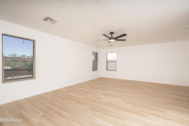 12424 N B St, El Mirage, AZ 85335 - spare room featuring ceiling fan, light wood-type flooring, and baseboards
