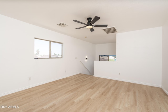 12424 N B St, El Mirage, AZ 85335 - empty room with light wood-style flooring, ceiling fan, and baseboards