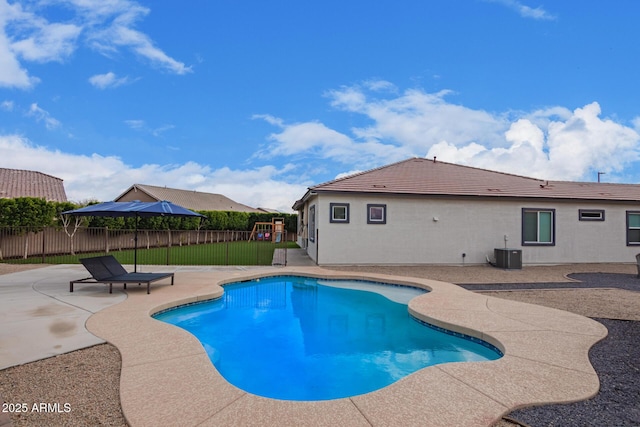 view of pool with a patio and central AC unit