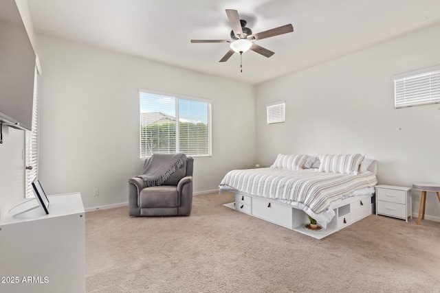 bedroom featuring light carpet and ceiling fan