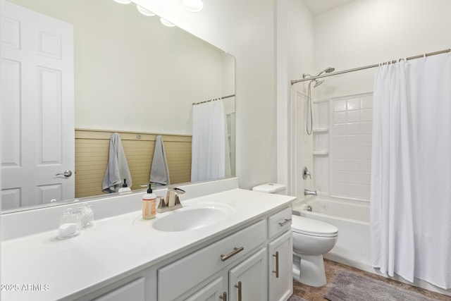 full bathroom with shower / tub combo with curtain, vanity, and toilet