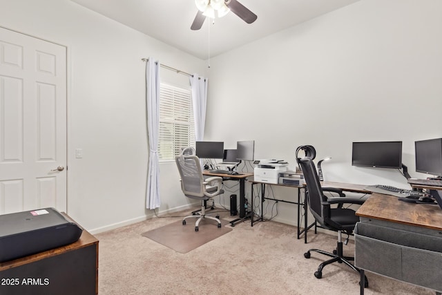 carpeted office space featuring ceiling fan