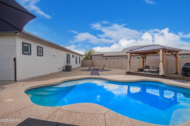 view of swimming pool featuring cooling unit, a gazebo, and a patio