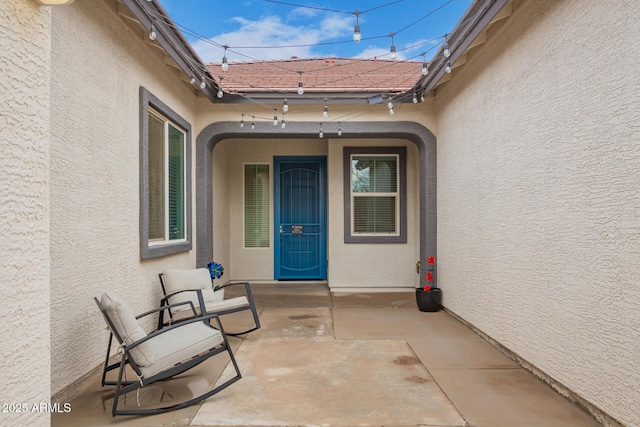 entrance to property with a patio area