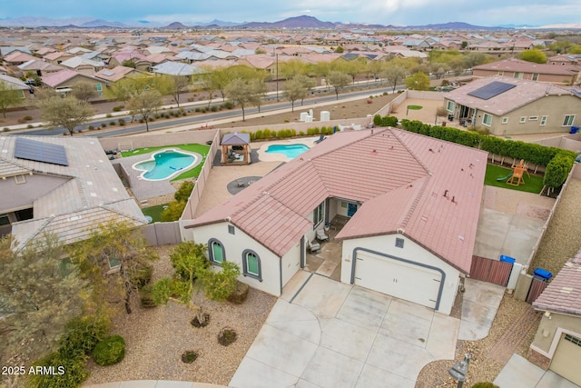 birds eye view of property with a mountain view