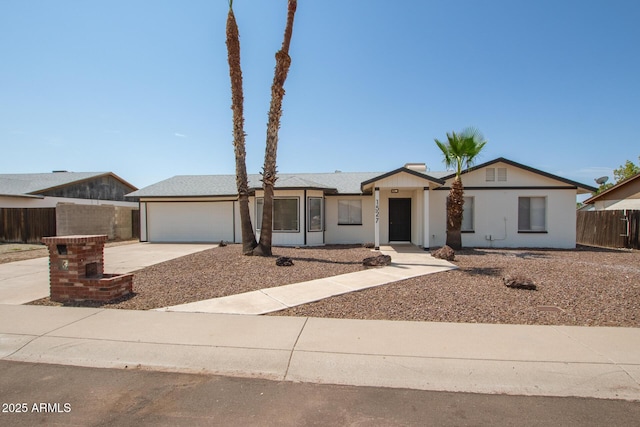 ranch-style house featuring a garage