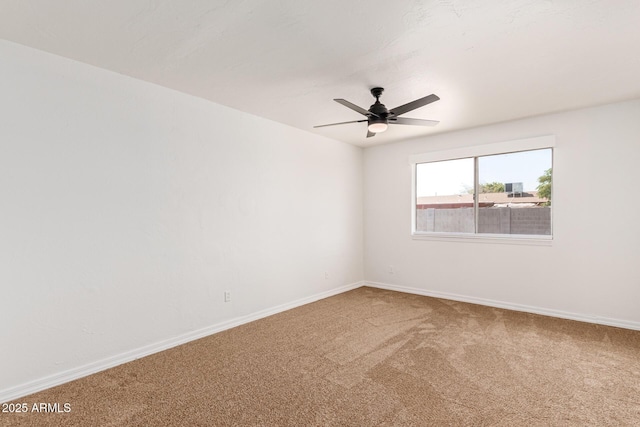 empty room featuring carpet floors and ceiling fan