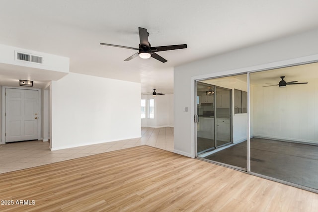 interior space with light wood-type flooring and ceiling fan