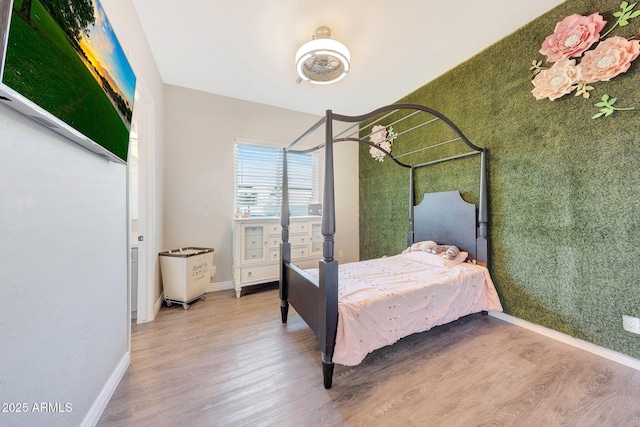 bedroom featuring hardwood / wood-style floors