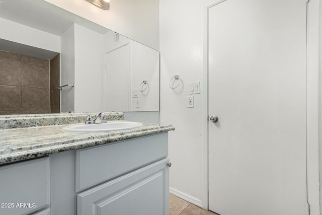 bathroom with tile patterned floors and vanity