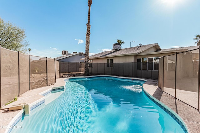 view of pool with central AC unit