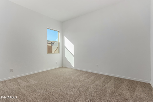 unfurnished room featuring carpet floors