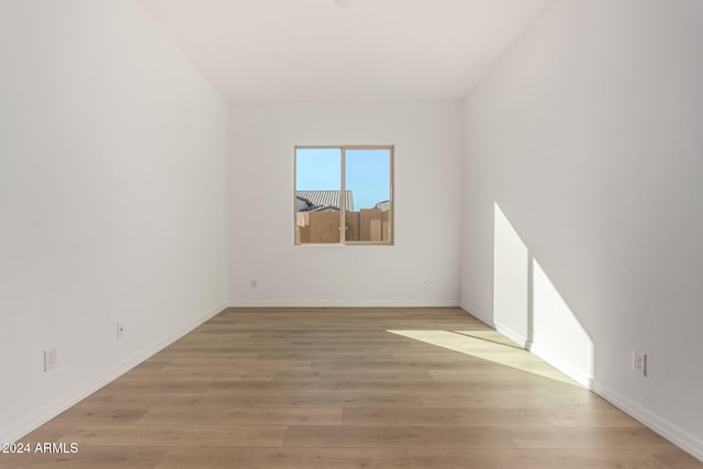 unfurnished room featuring light hardwood / wood-style flooring