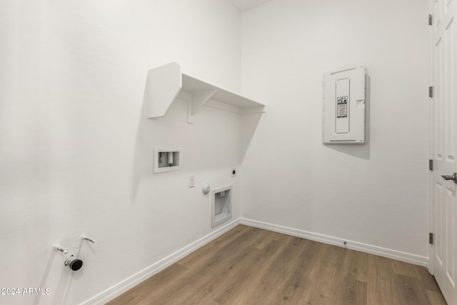 clothes washing area featuring hookup for a gas dryer, hookup for an electric dryer, hardwood / wood-style floors, and washer hookup