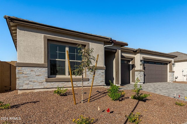 prairie-style house featuring a garage