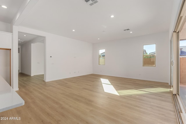 spare room featuring light hardwood / wood-style flooring