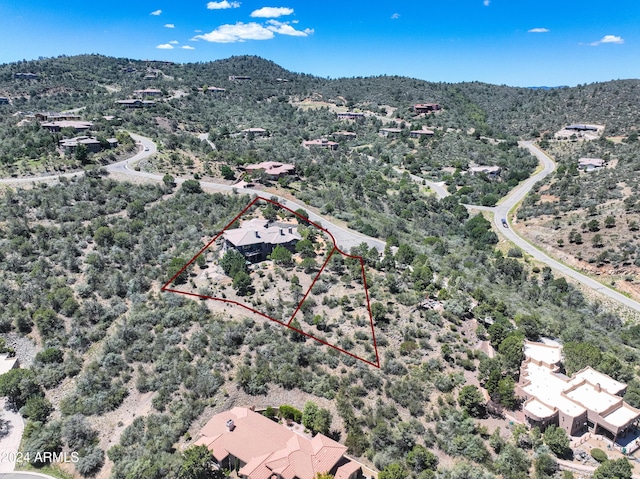 birds eye view of property featuring a mountain view