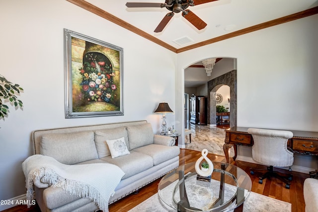 living room with hardwood / wood-style flooring, crown molding, and ceiling fan