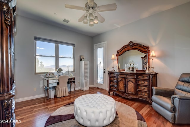 interior space with ceiling fan and hardwood / wood-style floors