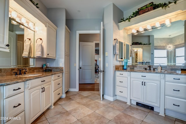 bathroom featuring double vanity and tile patterned floors