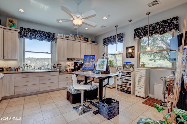 kitchen with ceiling fan, light brown cabinets, and light tile patterned flooring