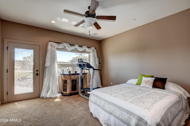 carpeted bedroom with multiple windows and ceiling fan