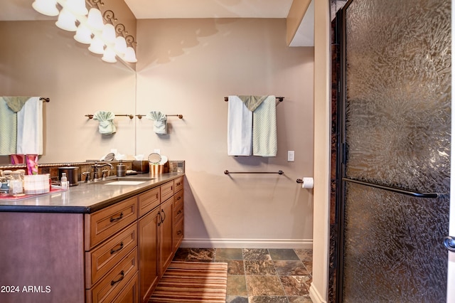 bathroom with tile patterned floors, vanity, and walk in shower