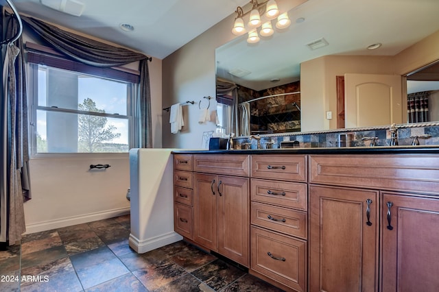 bathroom with double sink vanity and tile patterned floors