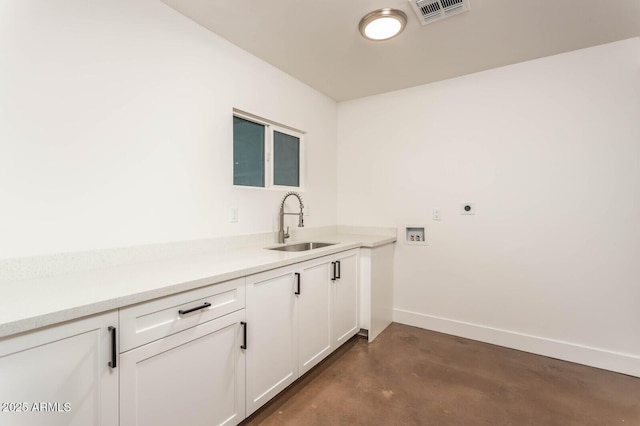 washroom with cabinets, washer hookup, hookup for an electric dryer, and sink