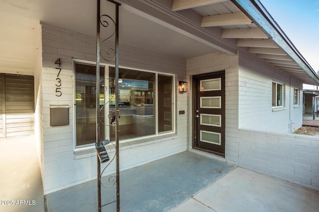 entrance to property featuring a patio