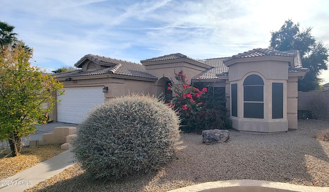 view of side of home with a garage