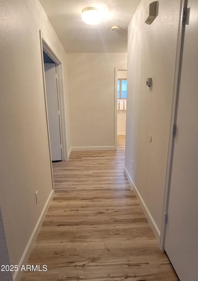 hallway featuring light hardwood / wood-style flooring